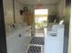 Community coin-operated laundry room featuring multiple washers and dryers at 3206 W Azeele St # 226, Tampa, FL 33609