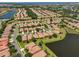 High angle aerial view of the community, its winding roads, and the waterways in Del Webb Southshore Falls at 336 Silver Falls Dr, Apollo Beach, FL 33572