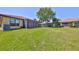 A lush green backyard with pond views and mature trees at 336 Silver Falls Dr, Apollo Beach, FL 33572