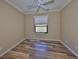 Bedroom with hardwood floors and natural light at 336 Silver Falls Dr, Apollo Beach, FL 33572