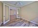 Bedroom with wood floors, ceiling fan and french doors leading to another room at 336 Silver Falls Dr, Apollo Beach, FL 33572