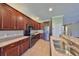 Updated kitchen with dark cabinets, granite countertops, and stainless steel appliances at 336 Silver Falls Dr, Apollo Beach, FL 33572