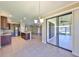 Open kitchen featuring stainless appliances, granite countertops, and access to the lanai at 336 Silver Falls Dr, Apollo Beach, FL 33572