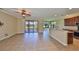 Open floor plan with kitchen featuring granite counters and stainless steel appliances at 336 Silver Falls Dr, Apollo Beach, FL 33572