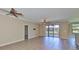 Bright and airy living room featuring tile flooring, neutral walls, and a ceiling fan for added comfort at 336 Silver Falls Dr, Apollo Beach, FL 33572