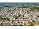 A community aerial view shows a neighborhood with mature trees and a serene atmosphere at 3654 Warbler Dr, New Port Richey, FL 34652
