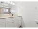 Modern bathroom featuring a spacious vanity with ample storage, hardwood floors, and a separate shower at 3654 Warbler Dr, New Port Richey, FL 34652