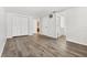 Spacious bedroom featuring wood-look flooring, a large closet, and an open layout at 3654 Warbler Dr, New Port Richey, FL 34652