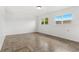 Bedroom showcasing tile flooring, ample natural light, and neutral walls at 3654 Warbler Dr, New Port Richey, FL 34652
