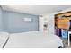 Bedroom with hardwood floors, an open door to the dining room, and a closet for storage at 3654 Warbler Dr, New Port Richey, FL 34652