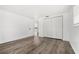 Bright, spacious bedroom with wood flooring and a double closet for ample storage at 3654 Warbler Dr, New Port Richey, FL 34652