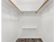 A functional closet with shelving and hanging rods, ready for organized storage at 3654 Warbler Dr, New Port Richey, FL 34652
