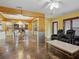 An open living space featuring stone flooring, a chandelier, and theater-style chairs at 402 S Barbara Ln, Tampa, FL 33609
