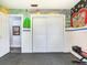 Open concept room with unique murals and a double closet with painted doors at 402 S Barbara Ln, Tampa, FL 33609