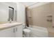 Cozy bathroom features a shower-tub combo with tile surround and vanity at 4118 Gauge Line Loop, Tampa, FL 33624