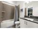 Bathroom featuring a tiled shower-tub combo and granite countertops at 4118 Gauge Line Loop, Tampa, FL 33624