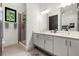 Contemporary bathroom with double vanity, modern fixtures, and ample lighting at 4118 Gauge Line Loop, Tampa, FL 33624