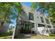 Modern home featuring large windows and grey exterior at 4118 Gauge Line Loop, Tampa, FL 33624