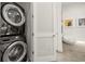 Modern laundry area with a stackable washer and dryer at 4118 Gauge Line Loop, Tampa, FL 33624