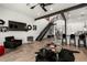 Stylish open concept living and kitchen area with modern decor, black accents, and ample natural light at 4118 Gauge Line Loop, Tampa, FL 33624