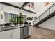 Open-concept living space with high ceilings, large windows, and modern finishes at 4118 Gauge Line Loop, Tampa, FL 33624