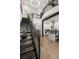 Open living area with a modern staircase, kitchen, and soaring ceilings at 4118 Gauge Line Loop, Tampa, FL 33624