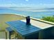 Intimate outdoor balcony with a table, chair, and plant enjoying a waterfront view at 4141 Bayshore Blvd # 1103, Tampa, FL 33611
