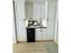 Elegant bar area with white cabinets, stylish backsplash, and modern wine cooler, perfect for entertaining at 4141 Bayshore Blvd # 1103, Tampa, FL 33611