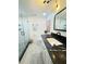 Modern bathroom featuring a glass-enclosed shower, stylish fixtures, and black countertop at 4141 Bayshore Blvd # 1103, Tampa, FL 33611