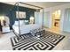Stylish bedroom with a four poster bed and an ensuite bathroom at 4141 Bayshore Blvd # 1103, Tampa, FL 33611