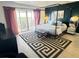 Spacious bedroom with a four poster bed and balcony access at 4141 Bayshore Blvd # 1103, Tampa, FL 33611