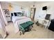 Light and airy bedroom with white walls, a chandelier, and a small vanity at 4141 Bayshore Blvd # 1103, Tampa, FL 33611