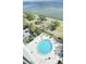 Aerial view of the outdoor pool, surrounded by lounge chairs and lush landscaping at 4141 Bayshore Blvd # 1103, Tampa, FL 33611