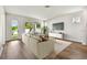 Bright living room with comfortable seating, a large window and a modern entertainment center at 4244 11Th N Ave, St Petersburg, FL 33713