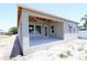 New construction features an open covered patio with multiple windows, and neutral color palette at 4244 11Th N Ave, St Petersburg, FL 33713