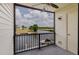 Balcony with iron railing and view of canal and boat docks at 428 Moorings Cove Dr # 7F, Tarpon Springs, FL 34689
