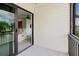Balcony with sliding glass door looking into living room at 428 Moorings Cove Dr # 7F, Tarpon Springs, FL 34689