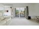 Living room balcony with tranquil water views offers the perfect outdoor retreat at 428 Moorings Cove Dr # 7F, Tarpon Springs, FL 34689