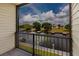 Balcony with iron railing and view of canal and boat docks at 428 Moorings Cove Dr # 7F, Tarpon Springs, FL 34689