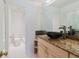 Stylish bathroom with a modern vessel sink and updated granite countertops at 428 Moorings Cove Dr # 7F, Tarpon Springs, FL 34689