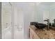 Stylish bathroom with a modern vessel sink and updated granite countertops at 428 Moorings Cove Dr # 7F, Tarpon Springs, FL 34689