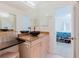 Stylish bathroom with a modern vessel sink and connection to Primary bedroom at 428 Moorings Cove Dr # 7F, Tarpon Springs, FL 34689