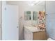 Bathroom featuring neutral walls, granite countertop, and white cabinets at 428 Moorings Cove Dr # 7F, Tarpon Springs, FL 34689
