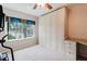 Bright bedroom with built in closet, desk and drawers, and a neutral carpet at 428 Moorings Cove Dr # 7F, Tarpon Springs, FL 34689