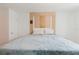 Bedroom featuring a large bed and a unique wooden headboard design at 428 Moorings Cove Dr # 7F, Tarpon Springs, FL 34689