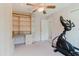Bedroom featuring neutral walls and a built in desk and shelving unit at 428 Moorings Cove Dr # 7F, Tarpon Springs, FL 34689