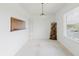 Bright dining area with view window, modern lighting, and stylish decor at 428 Moorings Cove Dr # 7F, Tarpon Springs, FL 34689