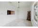 Well-lit dining area features a window, a breakfast bar, and stylish decor at 428 Moorings Cove Dr # 7F, Tarpon Springs, FL 34689