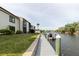 Exterior showcasing a private dock along the waterfront with boat mooring, set against the community at 428 Moorings Cove Dr # 7F, Tarpon Springs, FL 34689