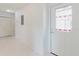 Bright entryway features tiled flooring, closet, and a front door with decorative stained glass at 428 Moorings Cove Dr # 7F, Tarpon Springs, FL 34689
